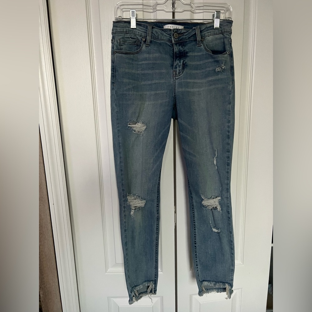 Mid rise skinny crop jeans. Fringe bottom. Size 7